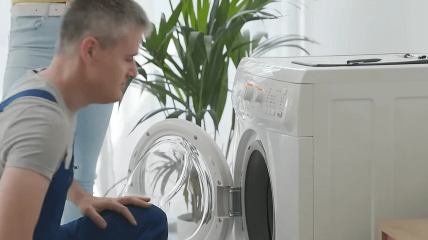 technician repairs washer appliance repair dc